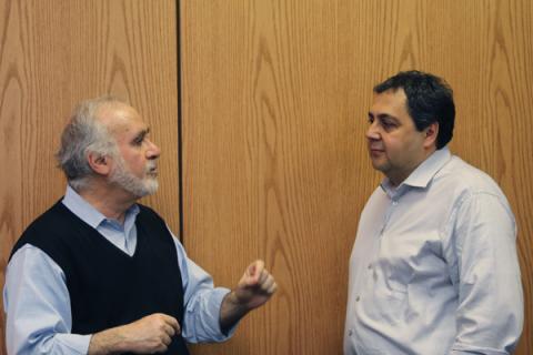 Haim Baruh (NJSGC Director and Rutgers University) discusses with Mehmet Alper Sahiner (Seton Hall University).